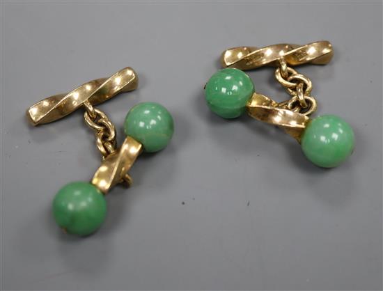 A pair of 9ct gold and jade cufflinks, designed as spiral-twist bars with jade bead ends.